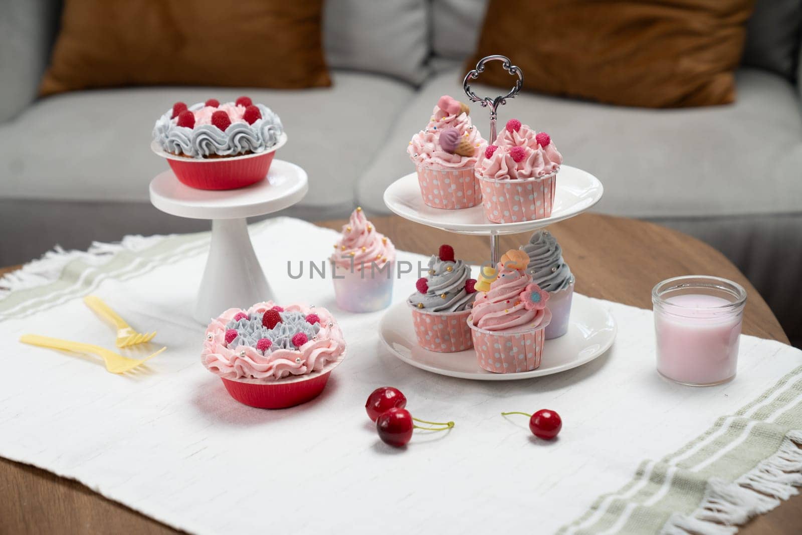 Presentation piece of cupcake on white standing cake with tea pot set in concept of pastel color's special cuisine. Content creative of social media with favorite sweets bakery dish. Tastemaker.