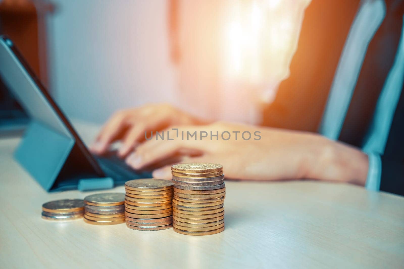 Businessman working with coin money currency. Concept of investment growth and money saving. uds