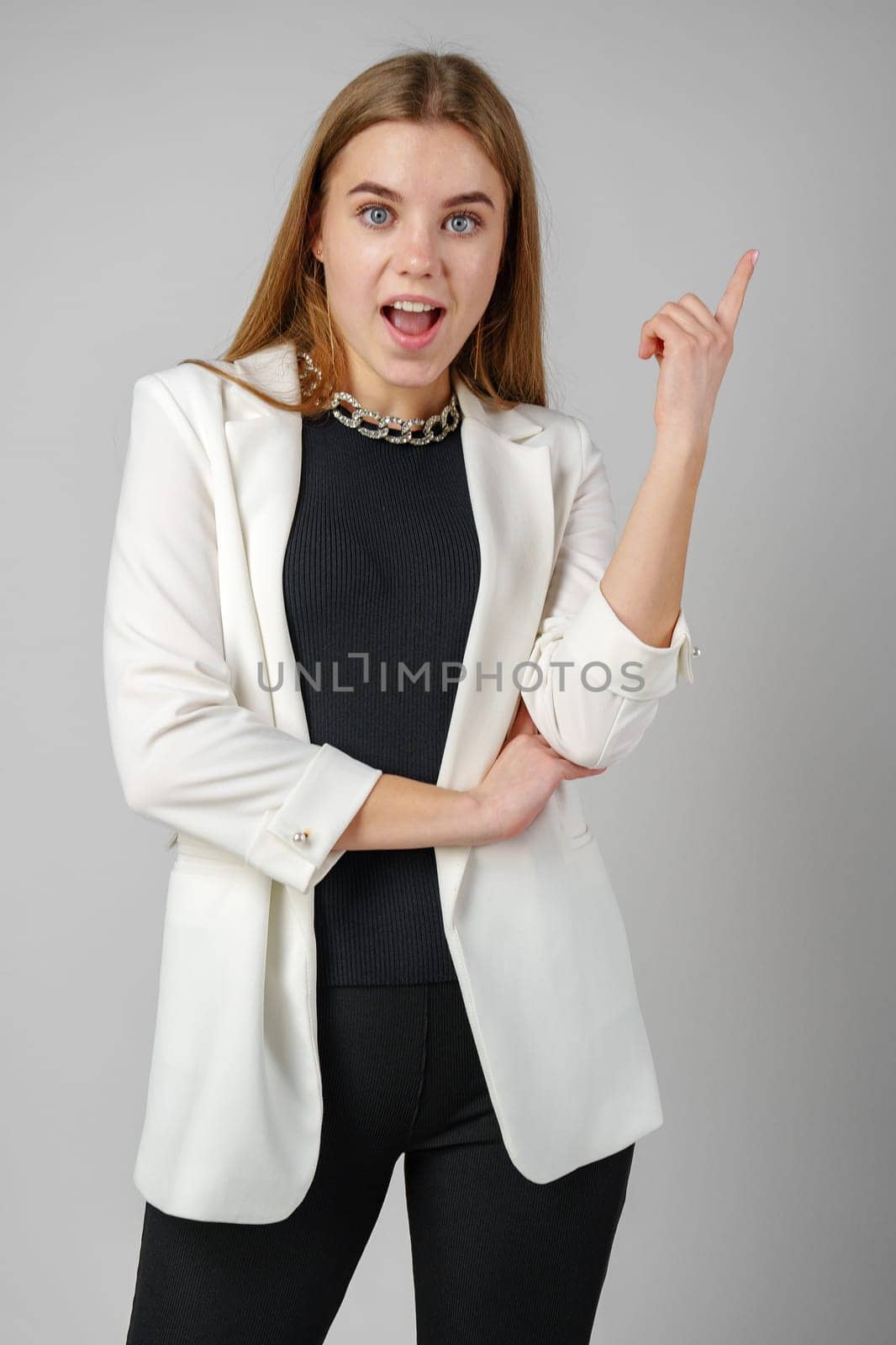 Excited Young Woman in Stylish Outfit Surprised Expression by Fabrikasimf