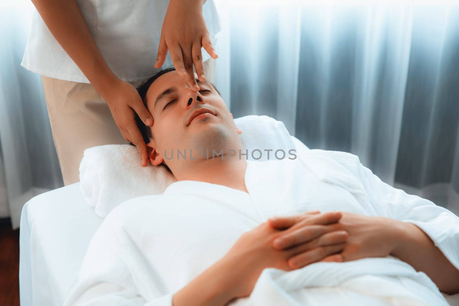 Caucasian man enjoying relaxing anti-stress head massage. Quiescent by biancoblue