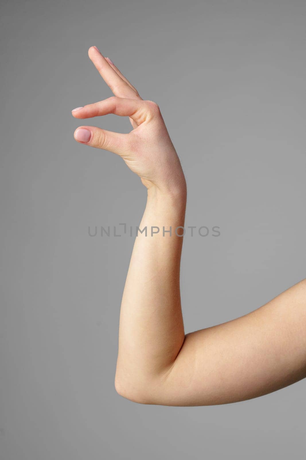 Woman Holding Arm Up in the Air with Gesture close up
