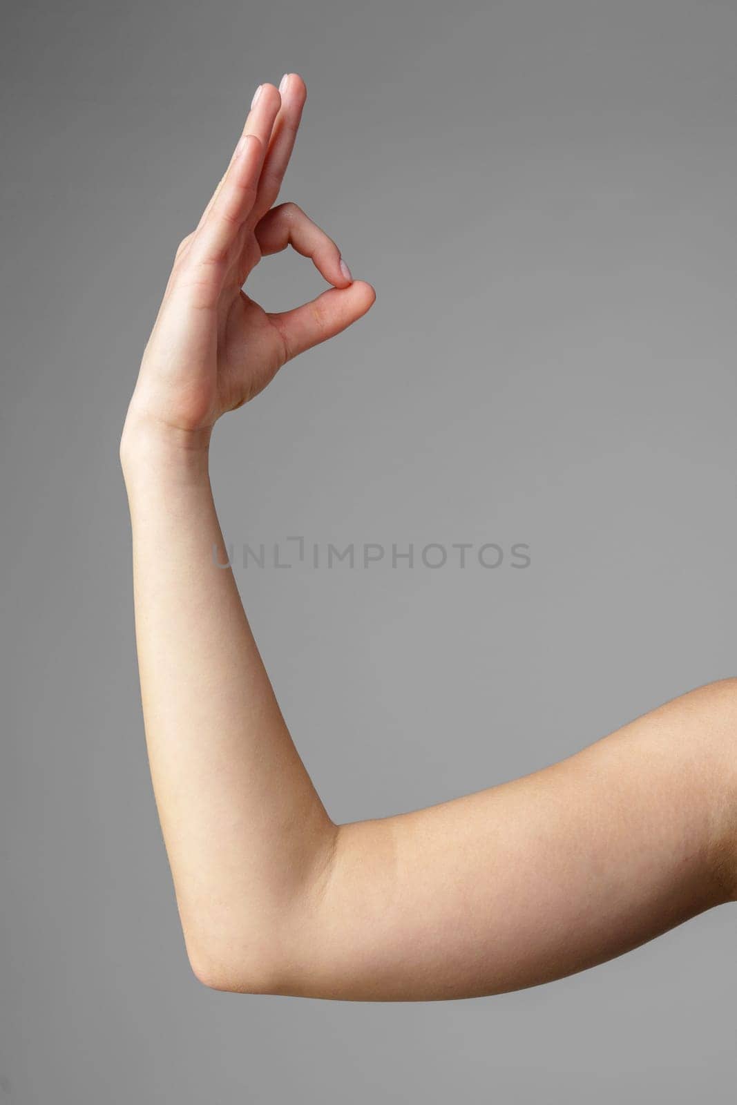 Woman Holding Arm Up in the Air with Gesture by Fabrikasimf