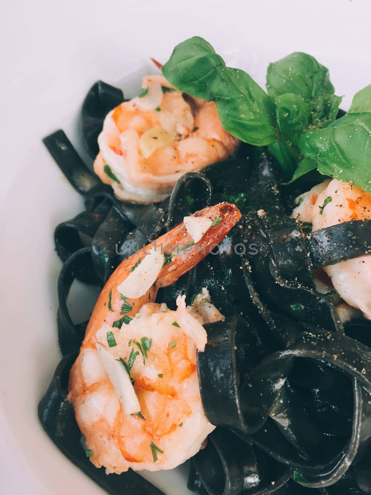 black spaghetti with prawn - pasta and italian cuisine recipes styled concept, elegant visuals