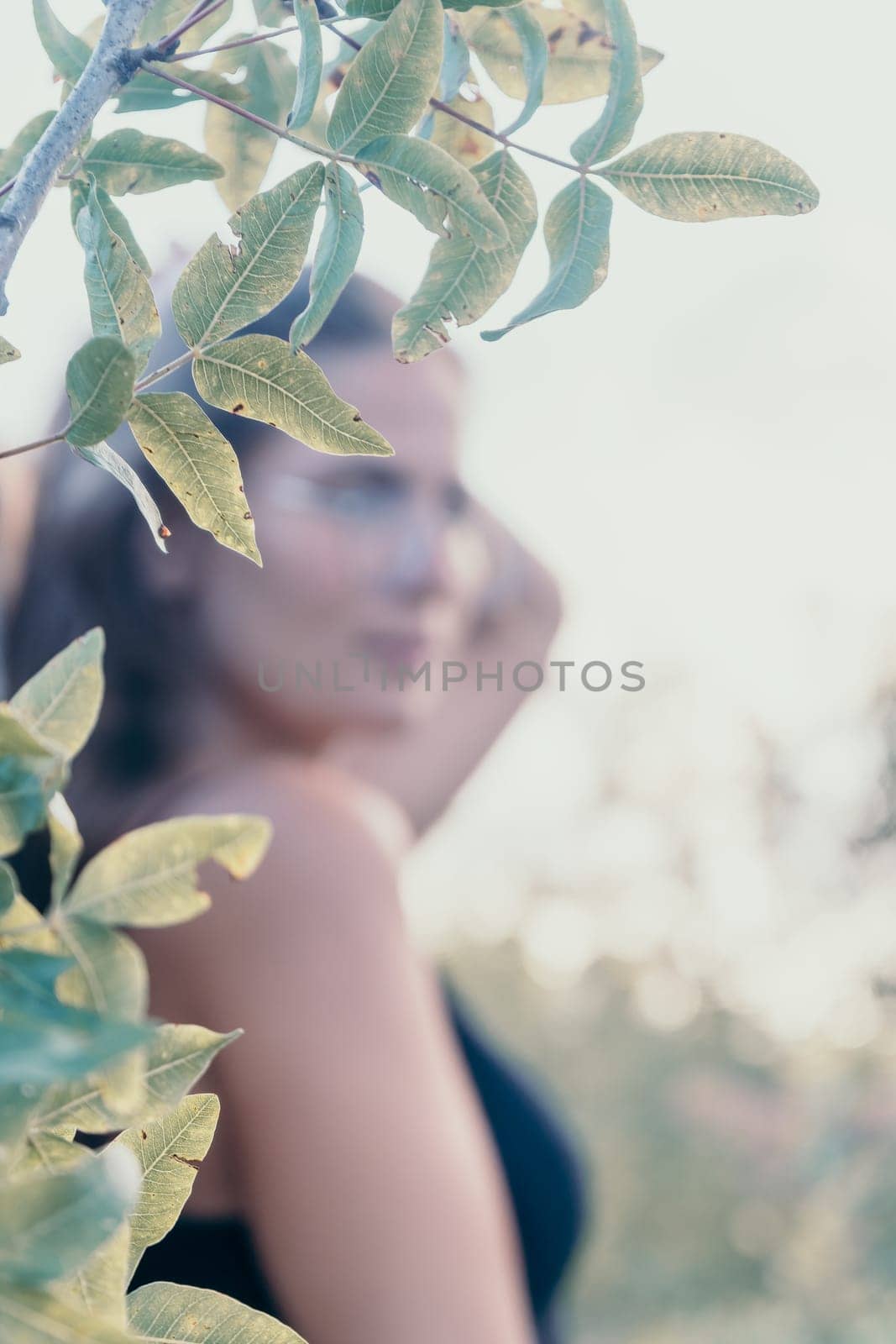 Woman summer travel. Happy tourist enjoy taking selfie photo outdoors for memories. Woman traveler posing in summer park on sunset, sharing travel adventure journey by panophotograph