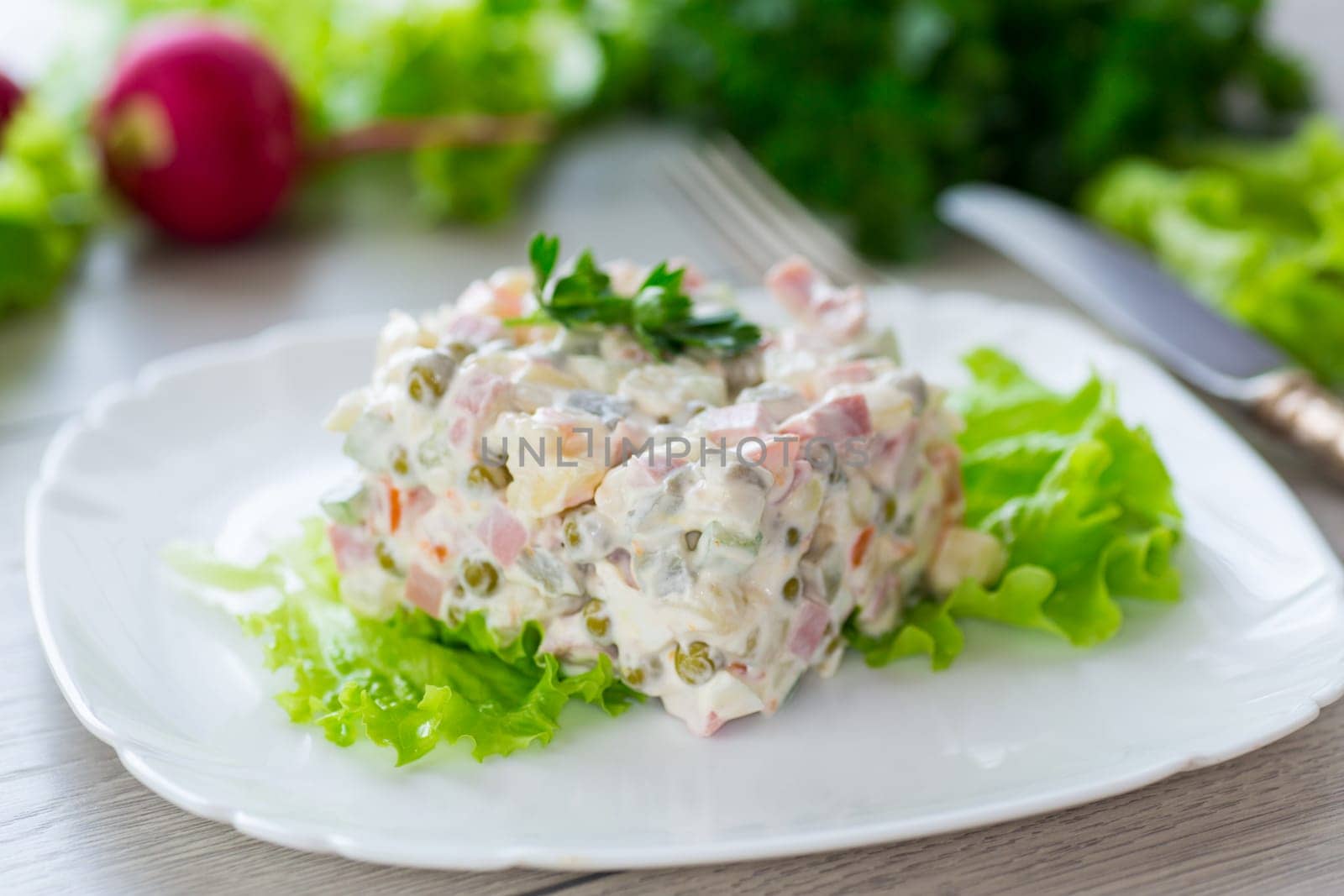 vegetable salad with boiled vegetables and dressed with mayonnaise by Rawlik