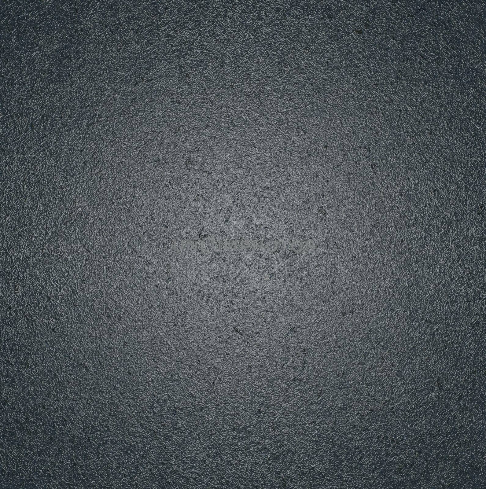 The texture of the background is gray with a rough glossy surface