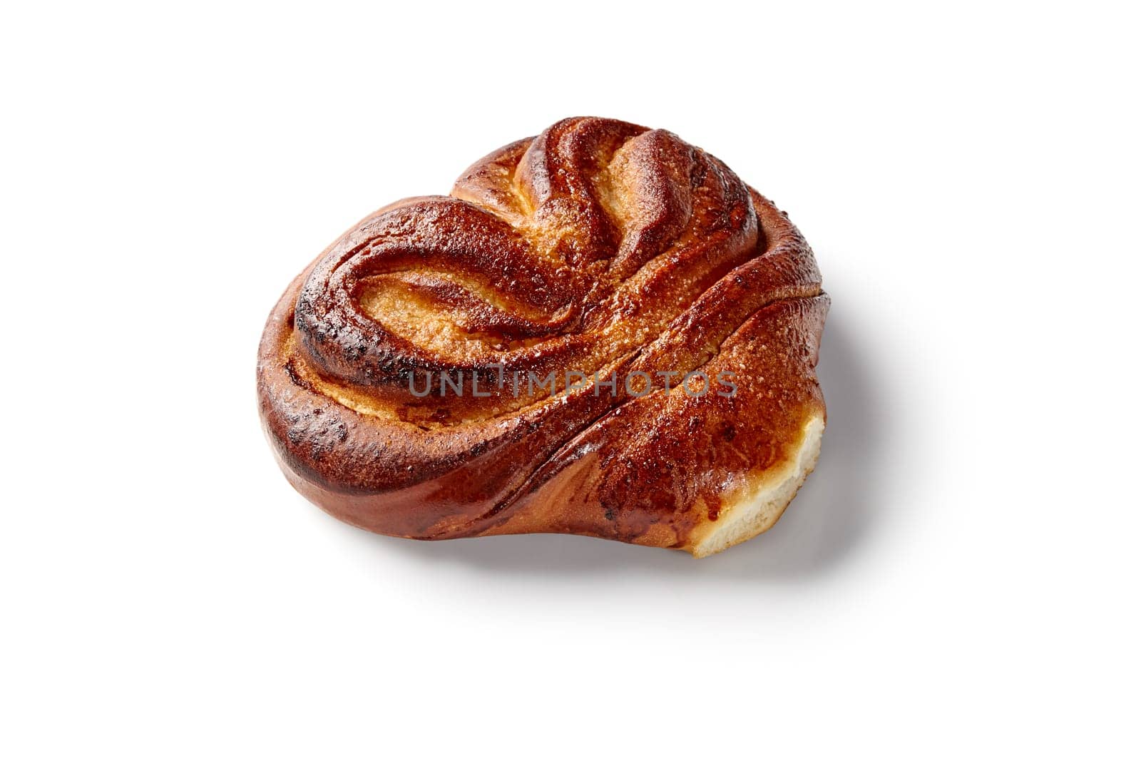 Fluffy browned sugar-dusted sweet bun, traditional Eastern European pastry, presented on white background