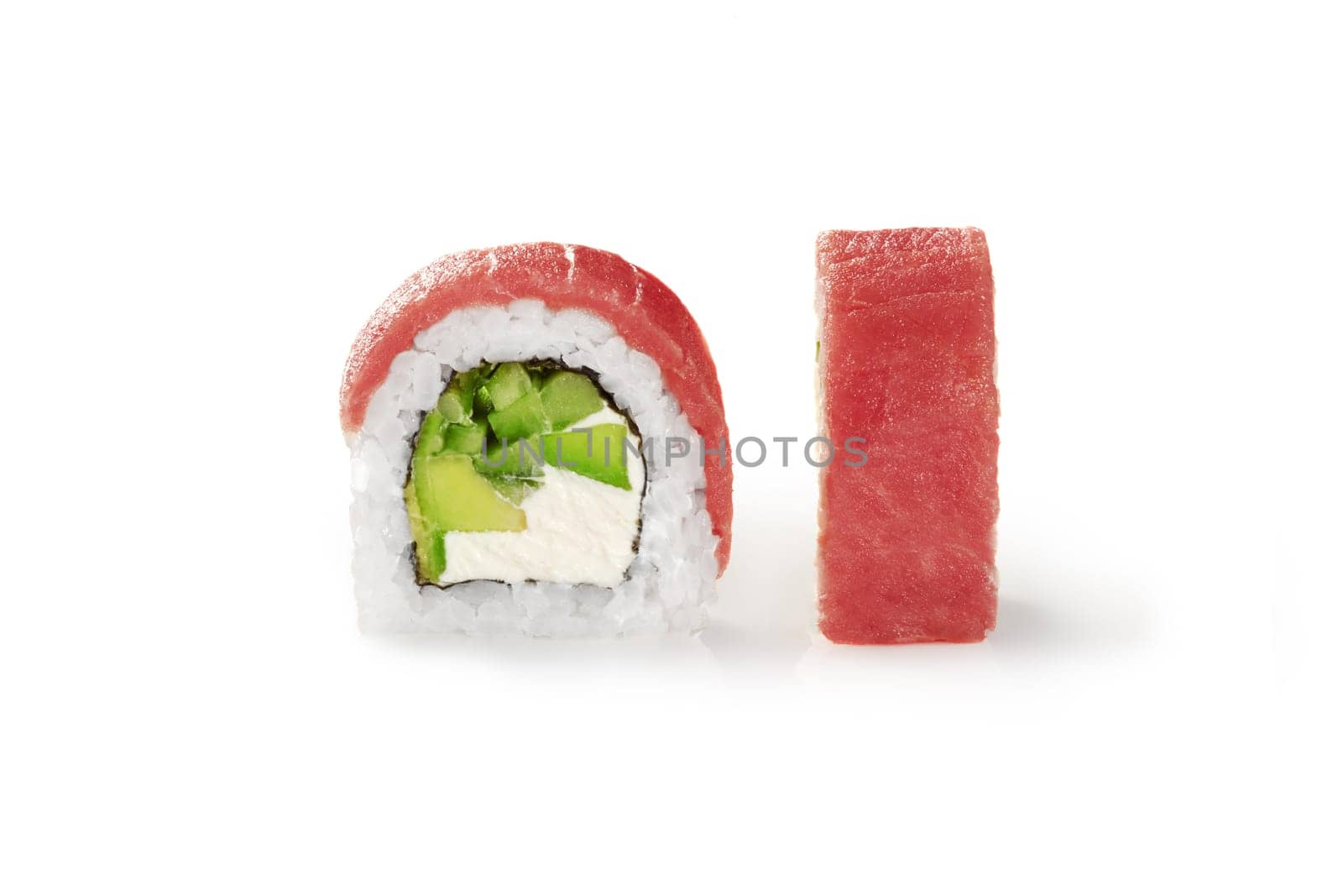 Closeup of delicious tuna sushi roll filled with cream cheese, avocado and cucumber, detailed view isolated on white background. Japanese cuisine