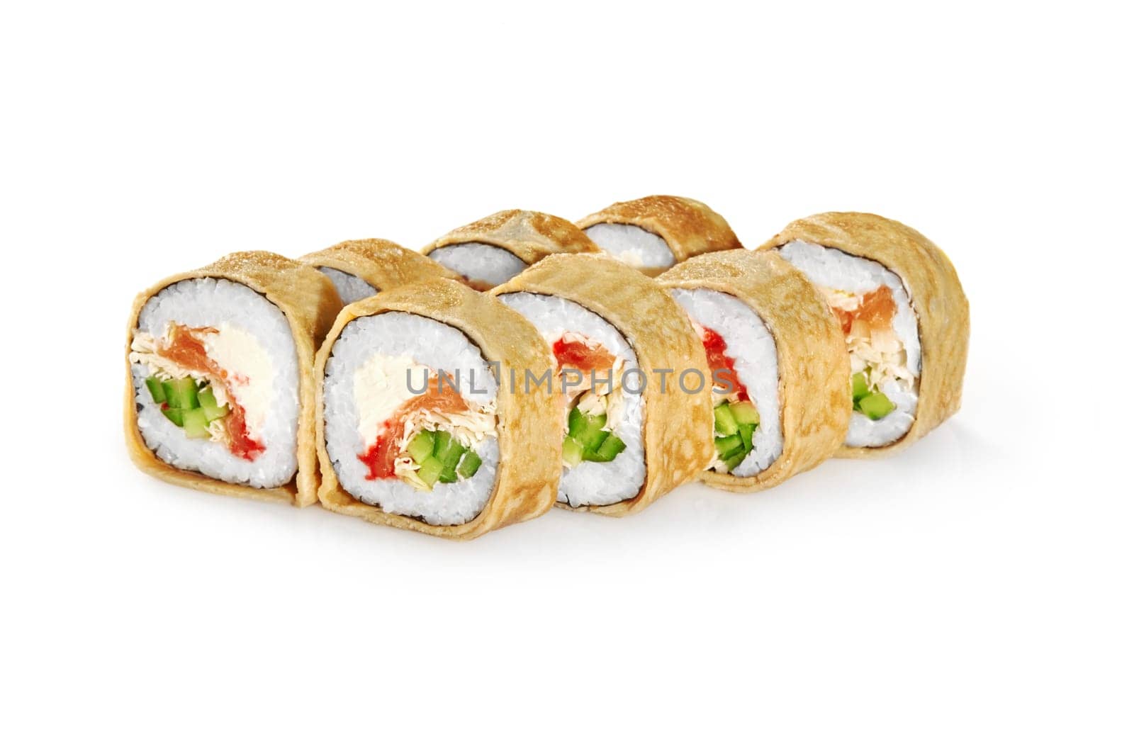Appetizing sushi rolls in crepe filled with salmon, tobiko, cream cheese, cucumber, and napa cabbage, isolated on white background