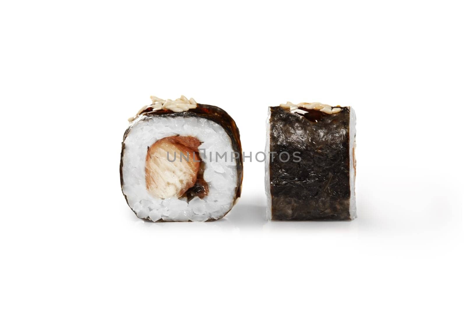 Closeup of maki rolls with eel, unagi sauce and sesame on white by nazarovsergey