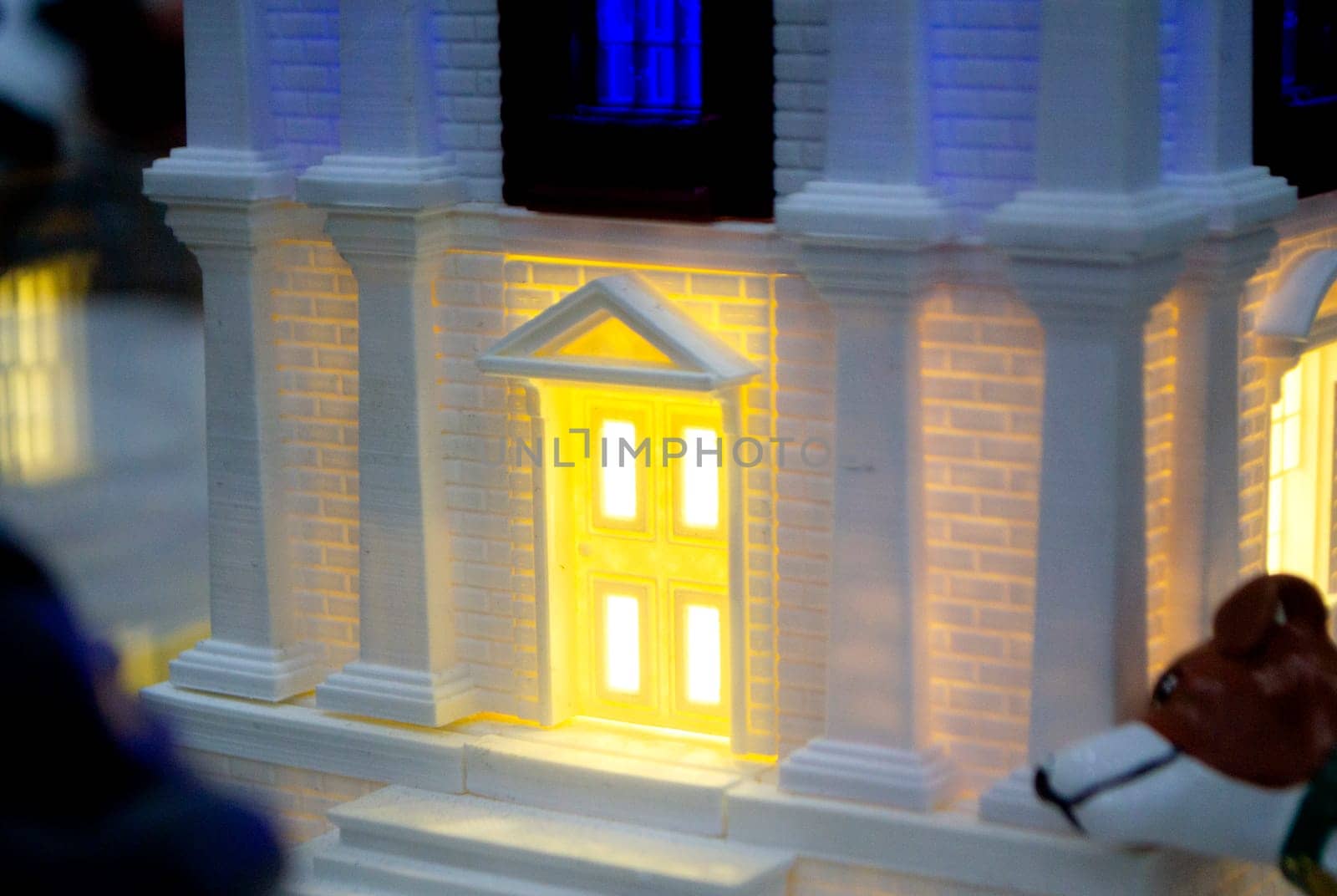 Prototype printed on 3D printer brick building with columns and glowing windows by Mari1408