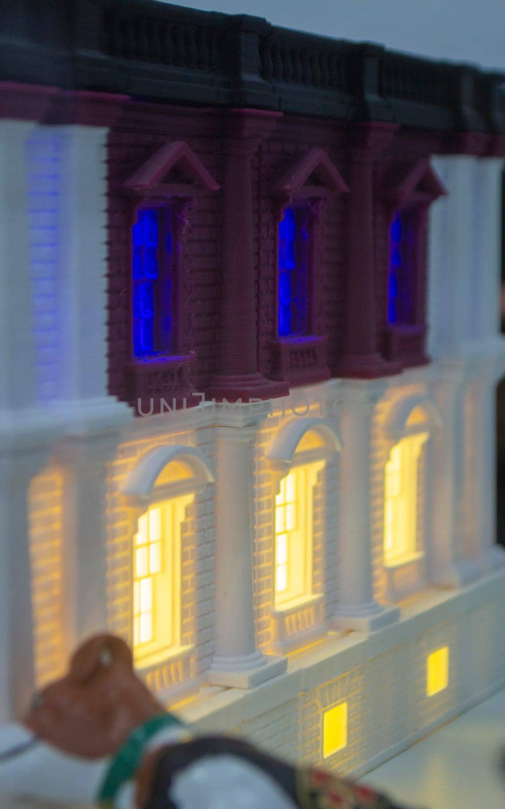 Prototype printed on 3D printer brick building with columns and glowing windows by Mari1408