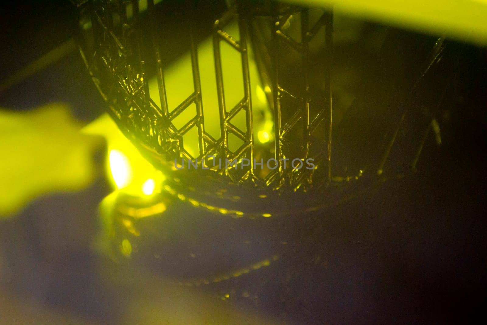 Working of photopolymer sla 3D printer. Platform with building object lowered by Mari1408