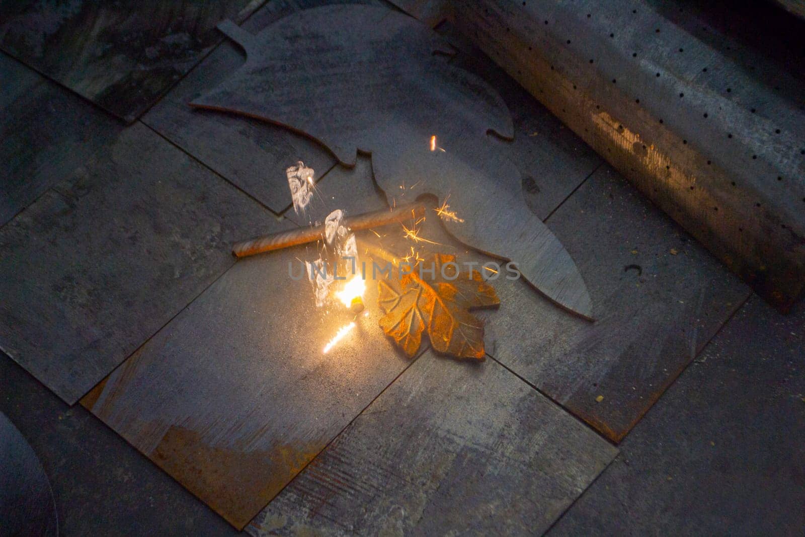 Laser cleaning of metal. The laser beam cleans the metal surface from rust. by Mari1408