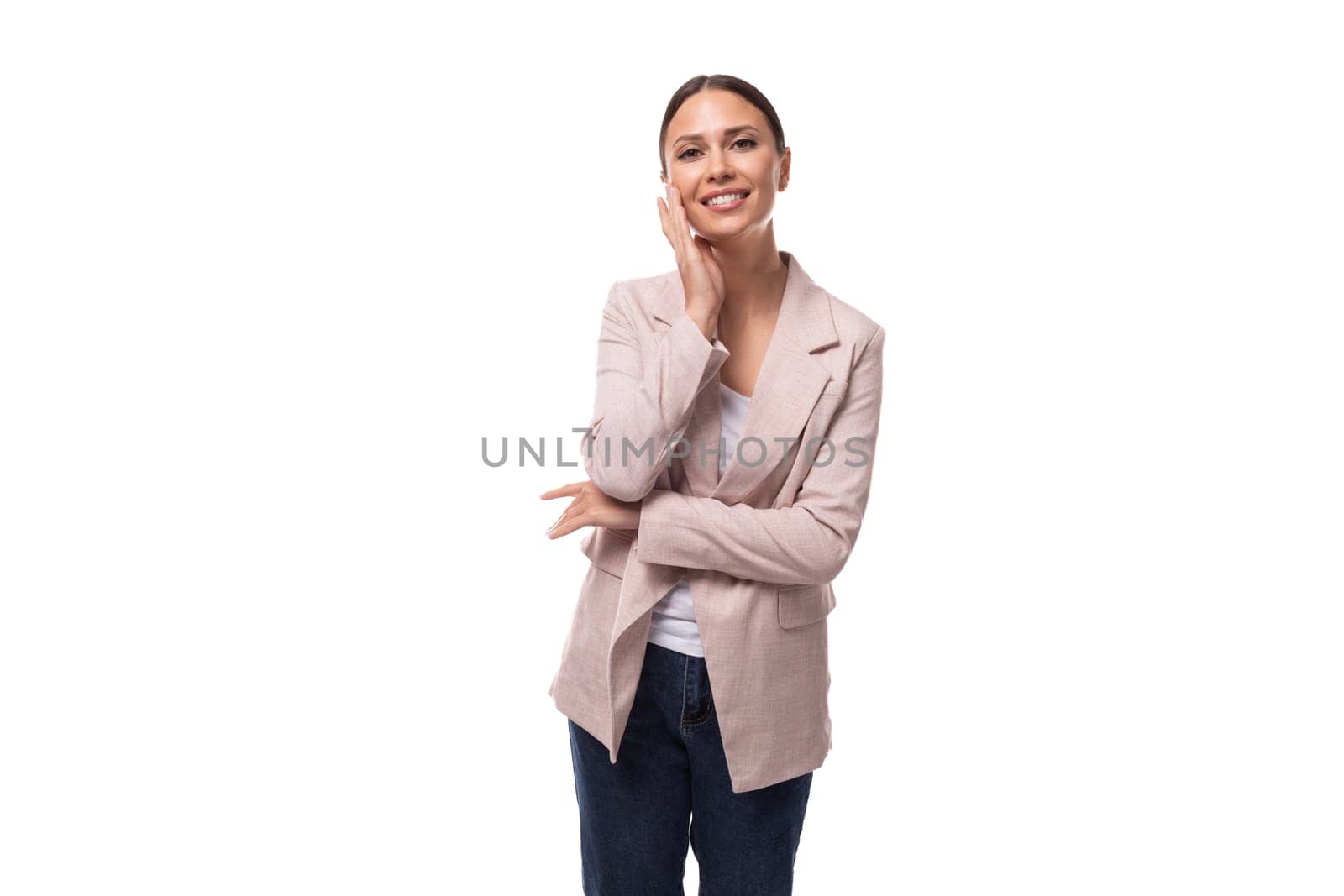 charming young woman with black hair in a jacket on a white background with copy space by TRMK