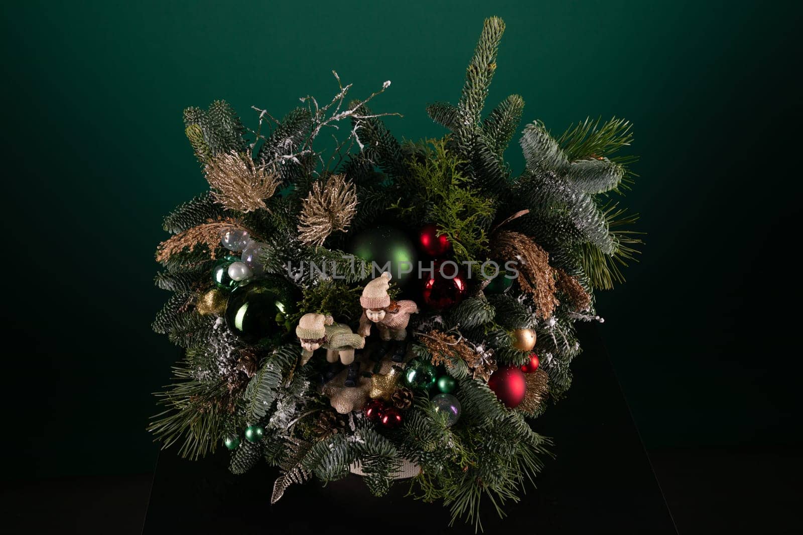 A Christmas Wreath With Ornaments on a Table by TRMK