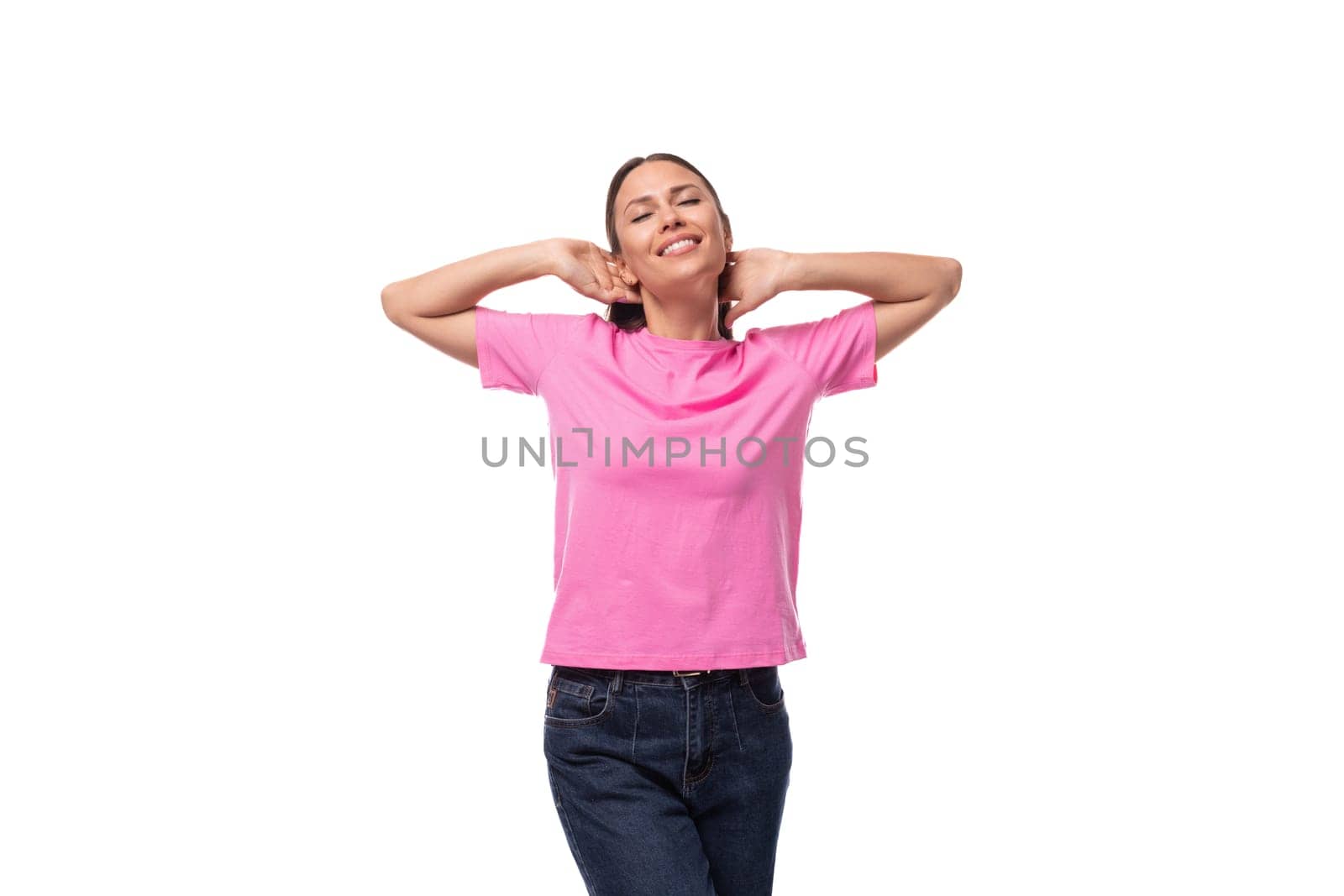 young beautiful model woman with straight black hair dressed in a pink t-shirt happy.