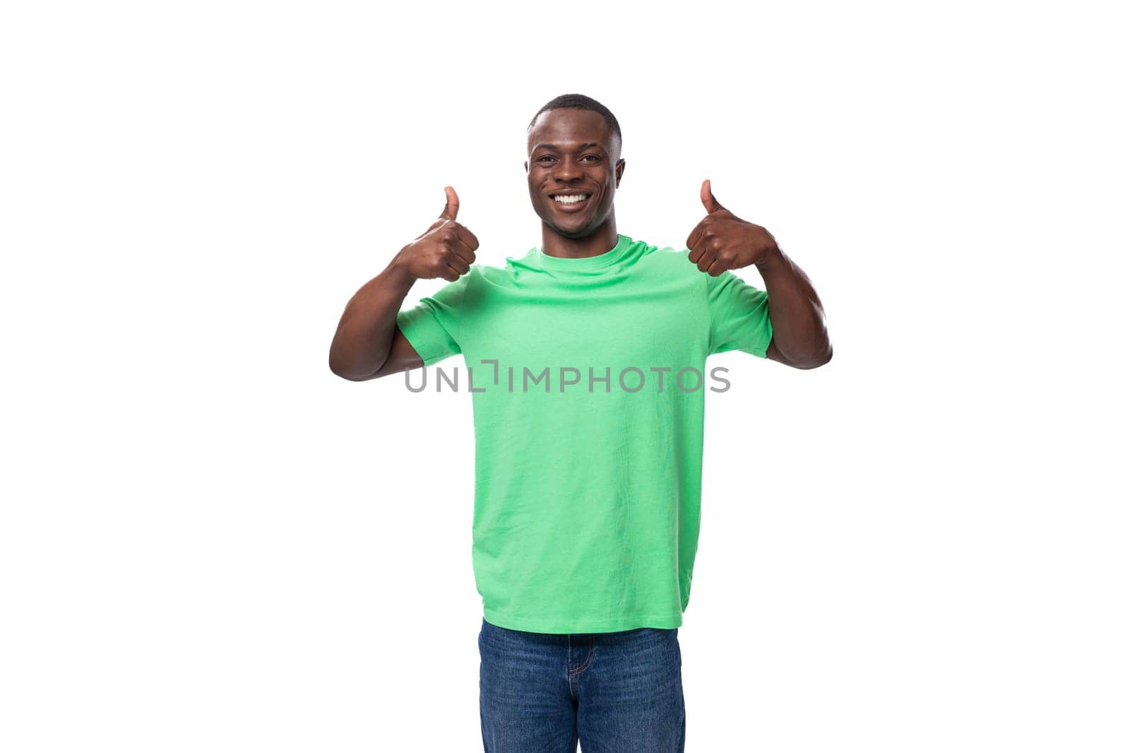 young american man dressed in a green corporate t-shirt on a white background with copy space by TRMK
