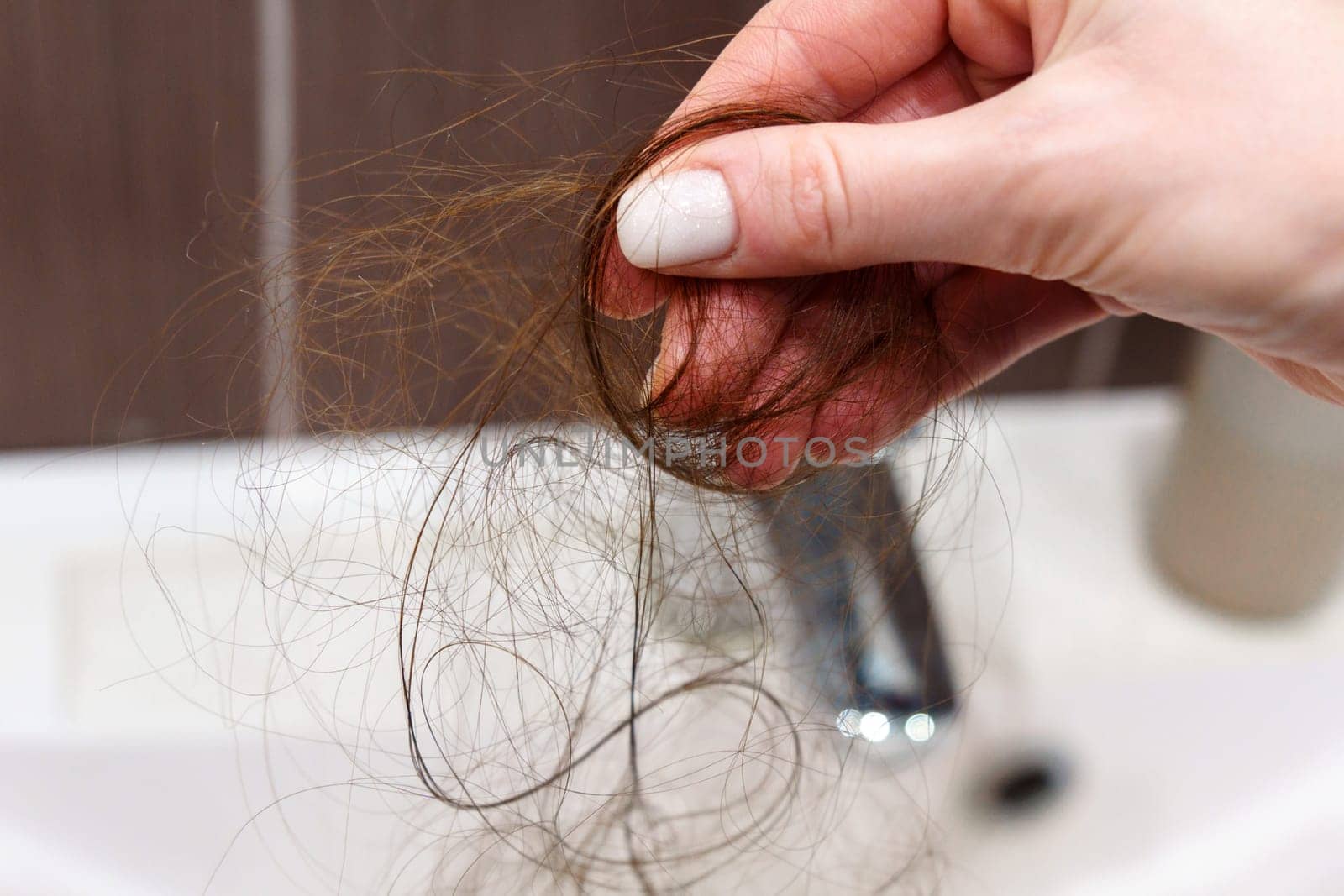 Close up reveals the challenges of an individual confronting hair loss. Selective focus