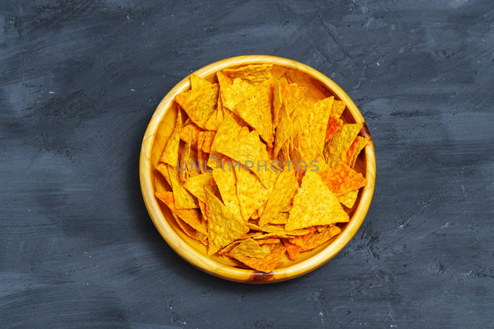 Yellow Bowl Filled With Tortilla Chips. Flat lay, close up by darksoul72