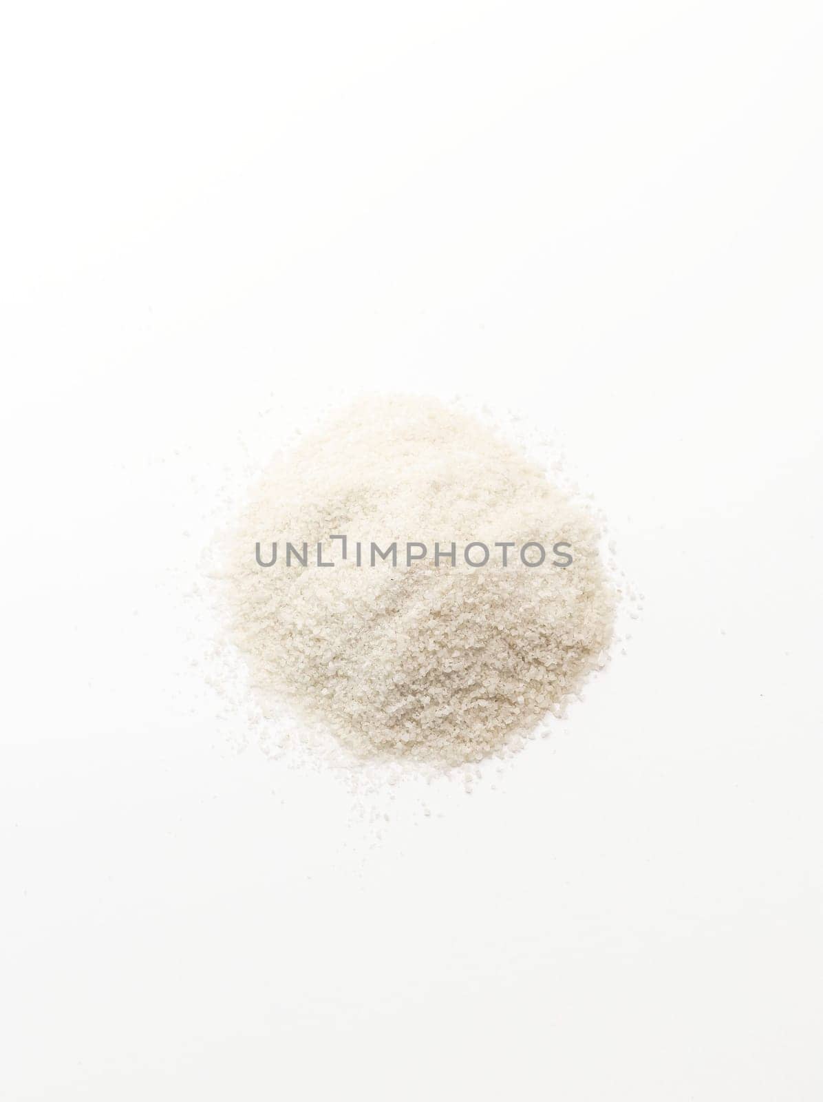 Isolated Celtic Gray Sea Salt On White Background, Vertical Plane. Top View. Natural And Unrefined Salt Harvested From Brittany, France. Superfood, Dieting. Natural Minerals And Trace Elements by netatsi