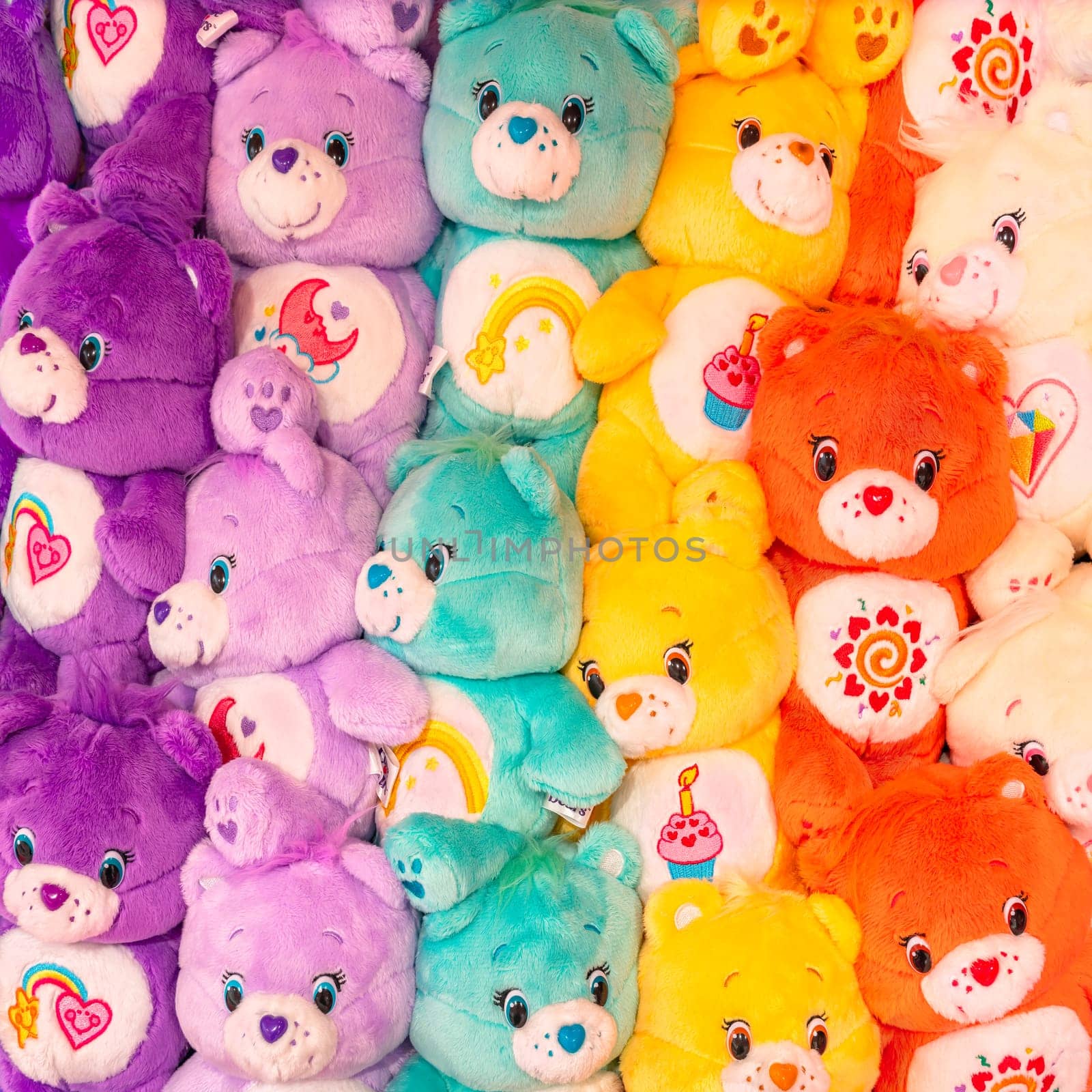 A cluster of vibrant Care Bears plushies, each embellished with endearing belly badges. by kuremo