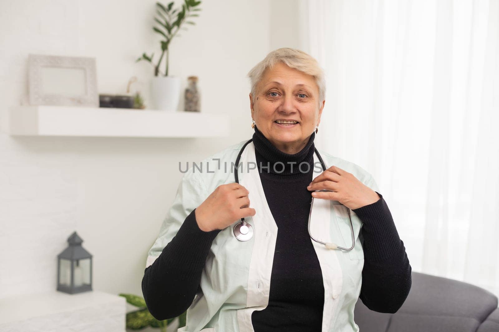 an elderly woman doctor, nurse.