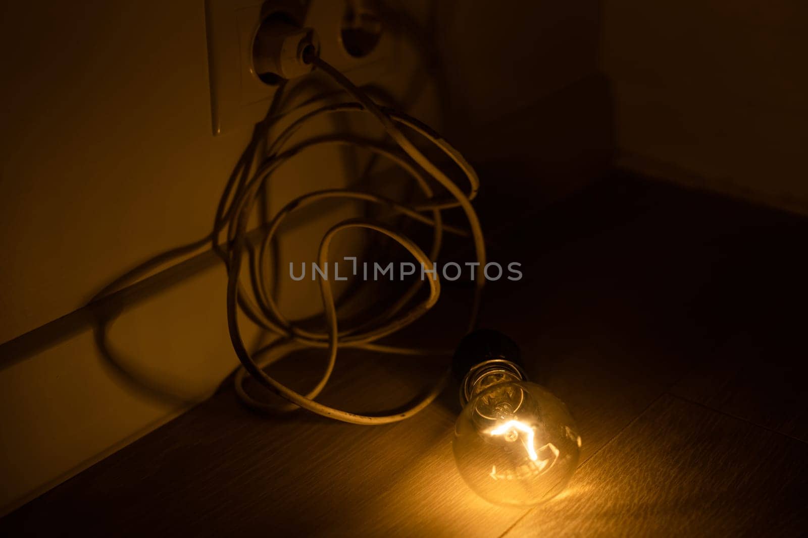 a light bulb with the cord lit