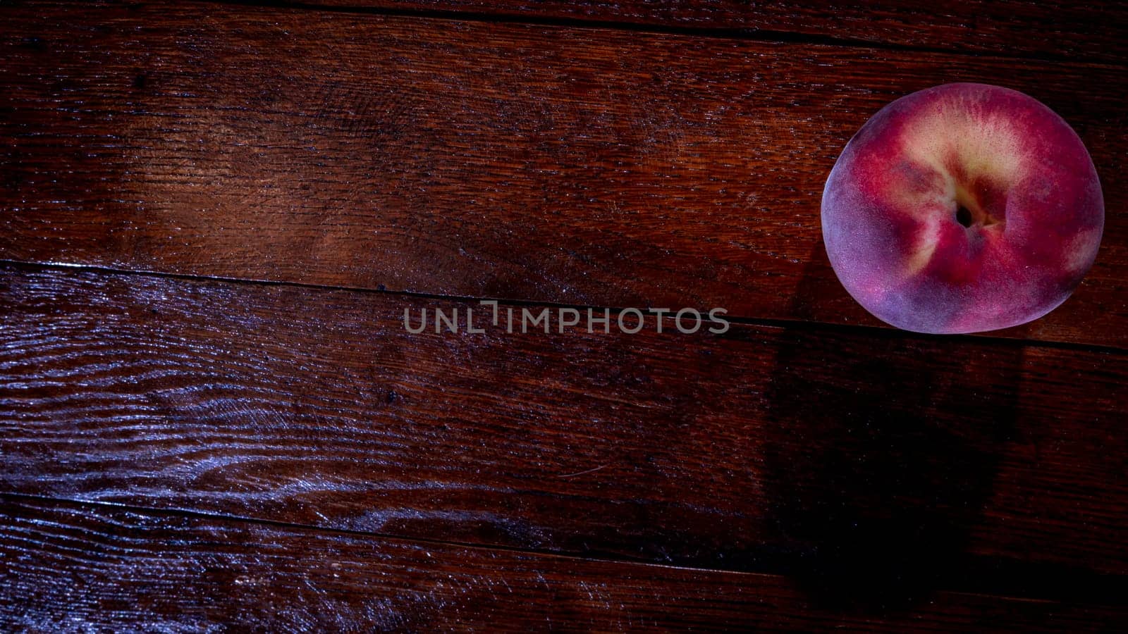 Fresh juicy peaches on rustic wooden table by vladispas