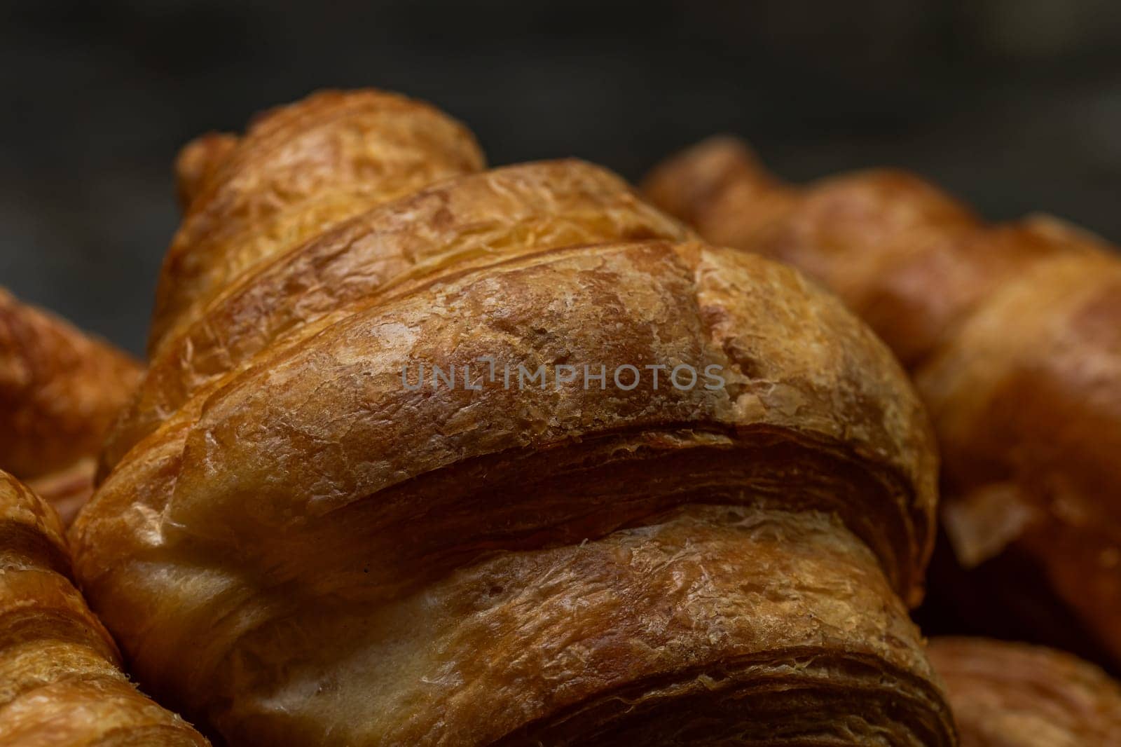 Freshly baked golden brown French croissants. Tasty baked croissants, warm buttery croissants and baked pastries by vladispas