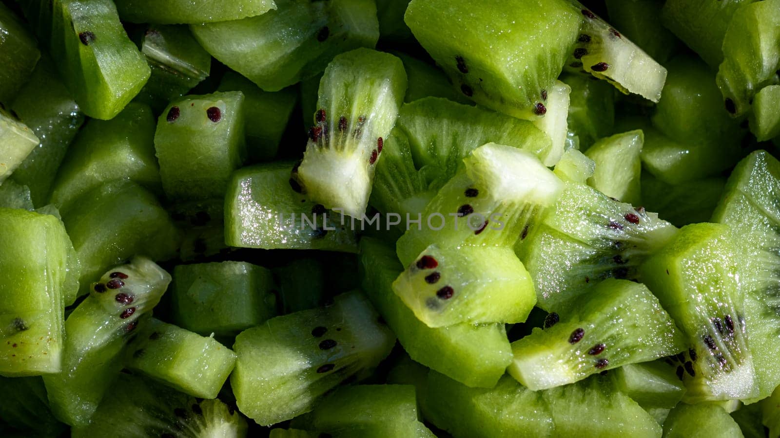Ripe kiwi fruit. Detail of chopped exotic kiwi fruits used for desserts
