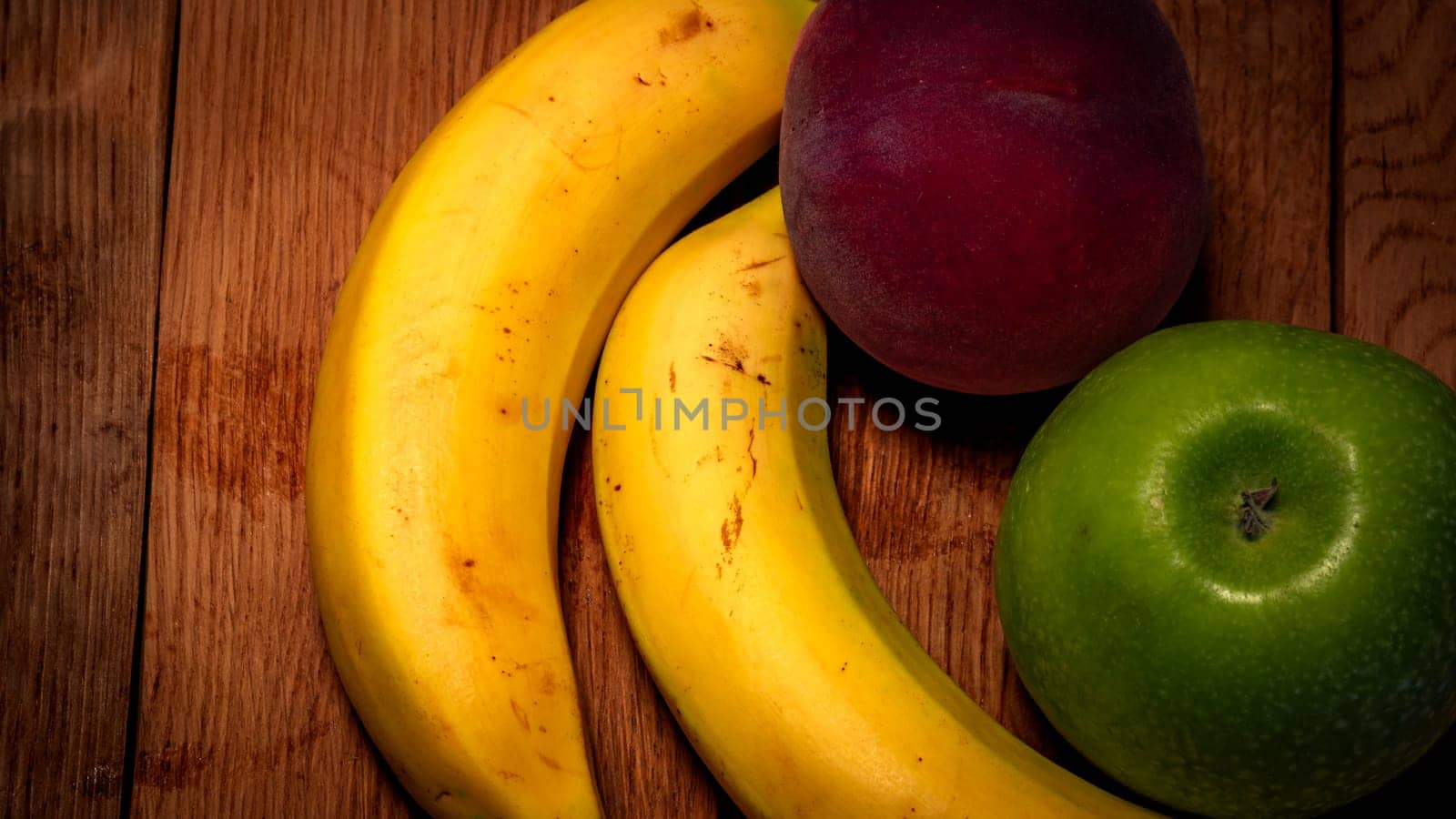 Mix of fresh fruits on wooden table