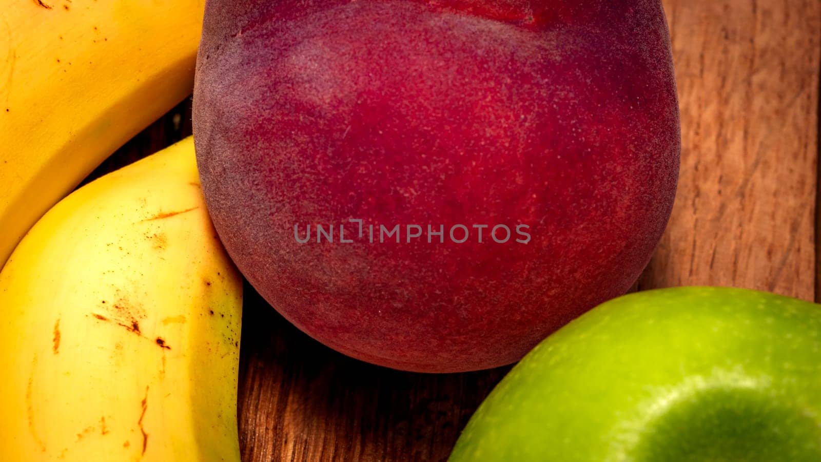 Mix of fresh fruits on wooden table by vladispas