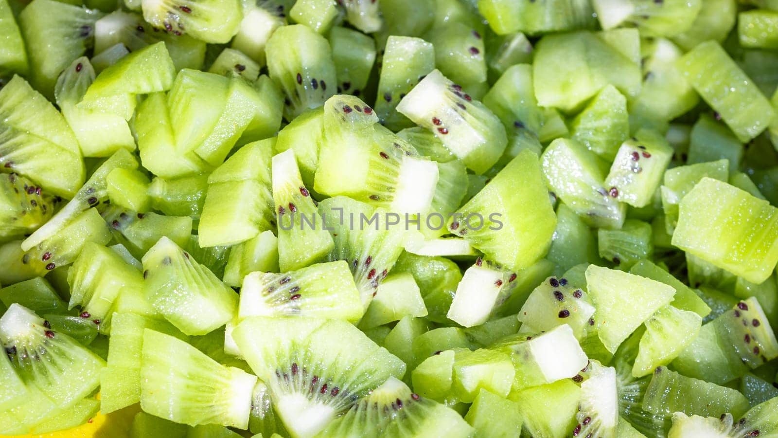 Ripe kiwi fruit. Detail of chopped exotic kiwi fruits used for desserts