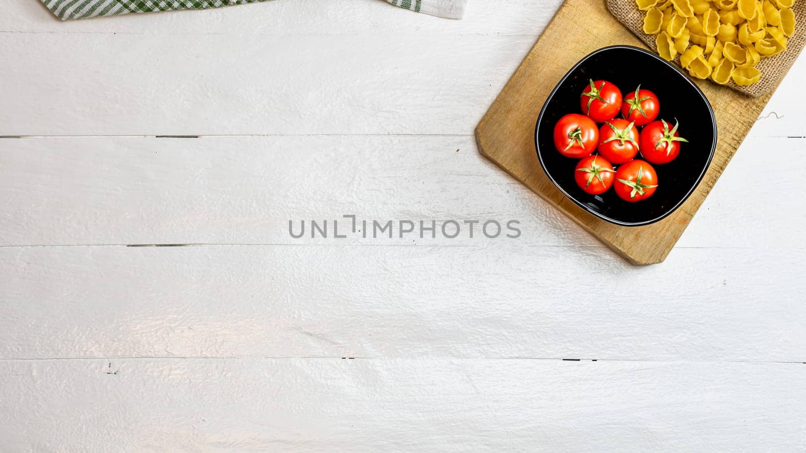 Beautiful tasty Italian pasta, tomatoes, onions and garlic for cooking pasta