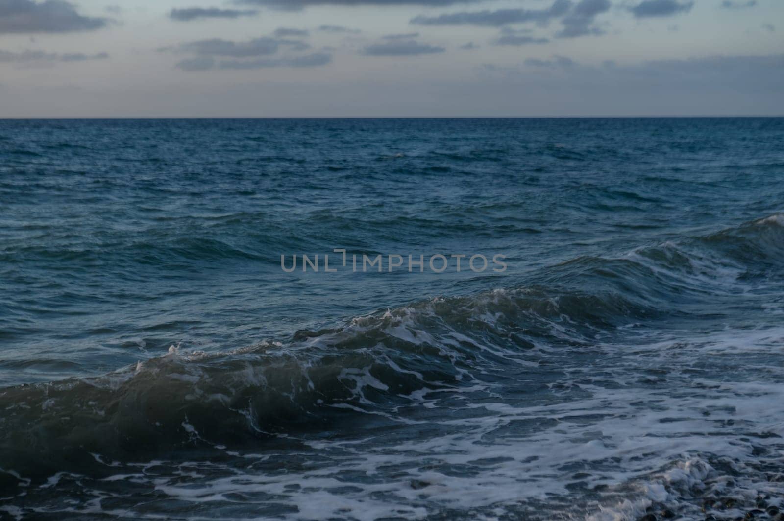 waves of the Mediterranean sea at sunset by Mixa74