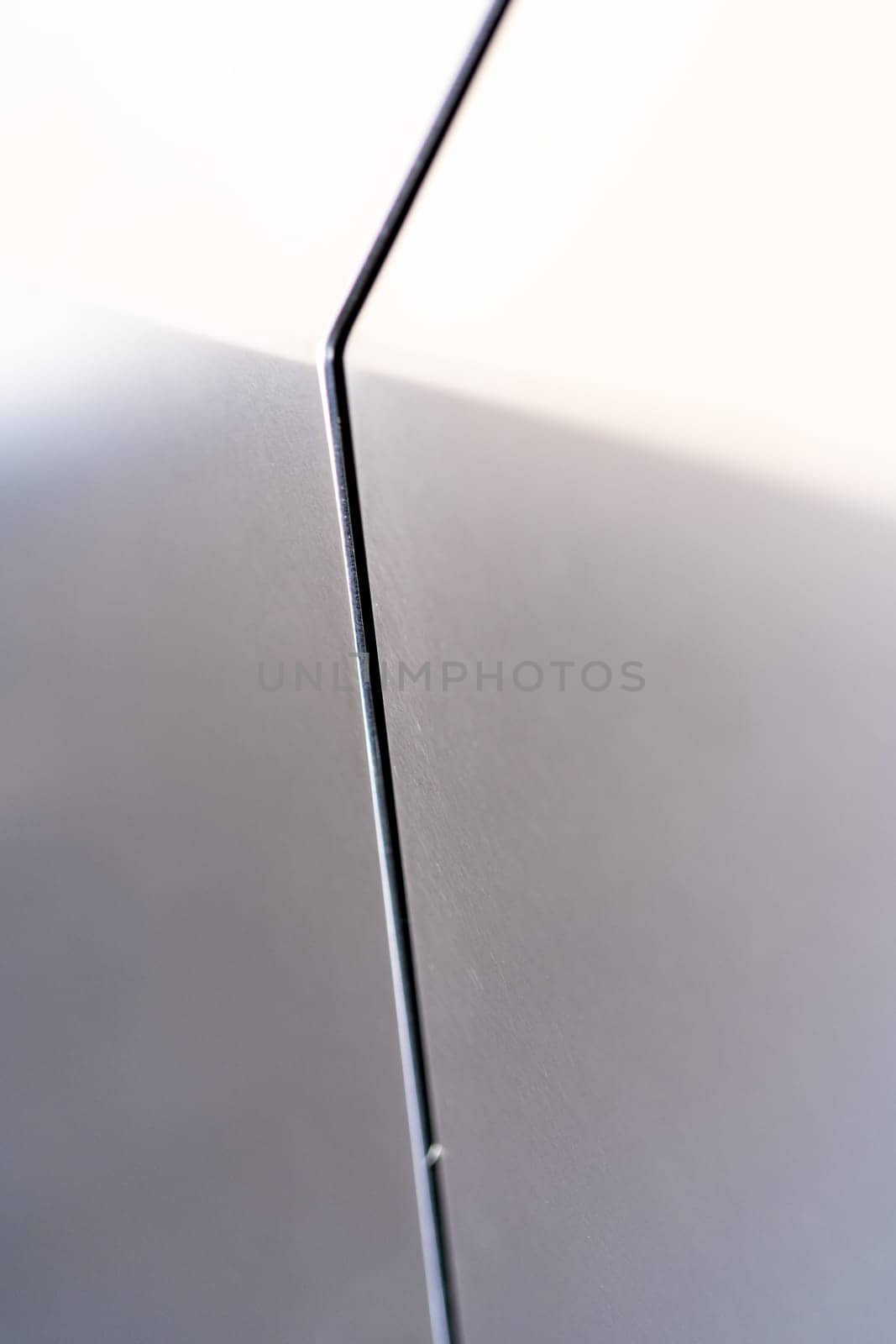 Denver, Colorado, USA-May 5, 2024-A close-up image capturing the precise panel seam of the Tesla Cybertruck, highlighting the minimalist design and sharp contours that characterize the exterior of this innovative electric vehicle.
