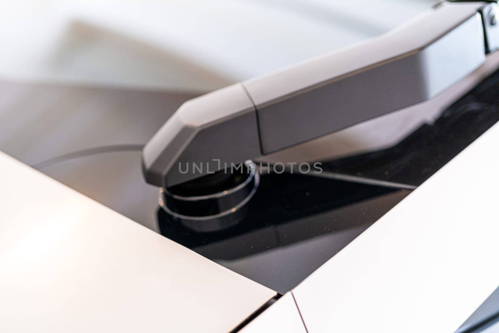 Denver, Colorado, USA-May 5, 2024-This image captures a close-up view of the windshield wipers on a Tesla Cybertruck, showcasing their unique design and integration into the futuristic exterior of the vehicle.