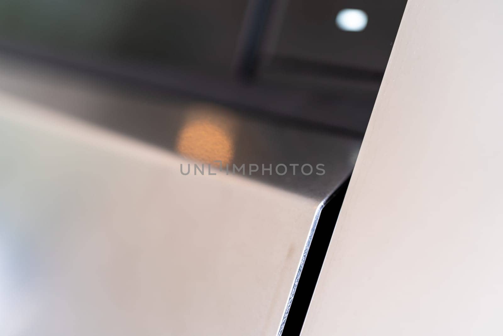 Denver, Colorado, USA-May 5, 2024-This image provides a close-up look at a car door opener, showcasing the clean lines and modern design typical of contemporary vehicle interiors. The focus on the mechanism highlights its sleek, minimalist style.