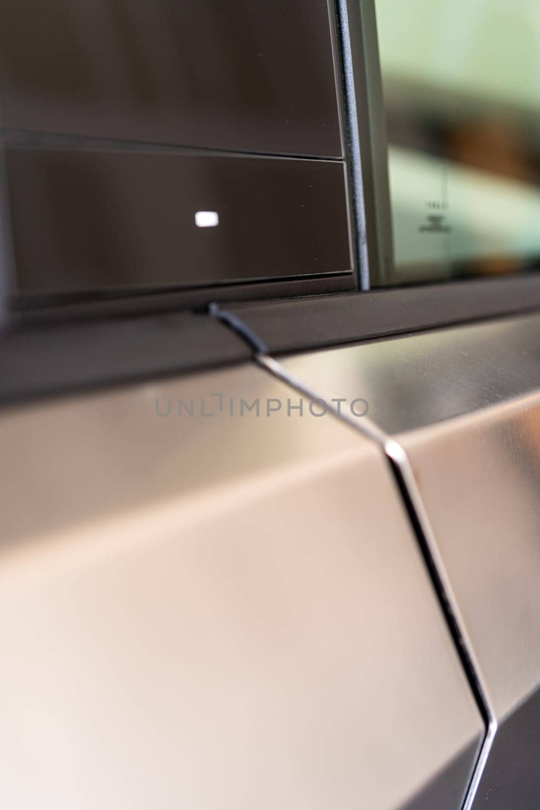 Denver, Colorado, USA-May 5, 2024-This image provides a close-up look at a car door opener, showcasing the clean lines and modern design typical of contemporary vehicle interiors. The focus on the mechanism highlights its sleek, minimalist style.