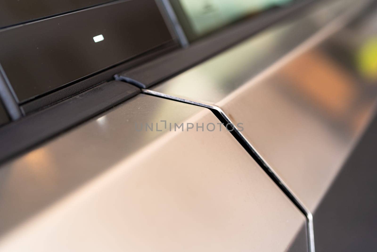 Denver, Colorado, USA-May 5, 2024-This image provides a close-up look at a car door opener, showcasing the clean lines and modern design typical of contemporary vehicle interiors. The focus on the mechanism highlights its sleek, minimalist style.