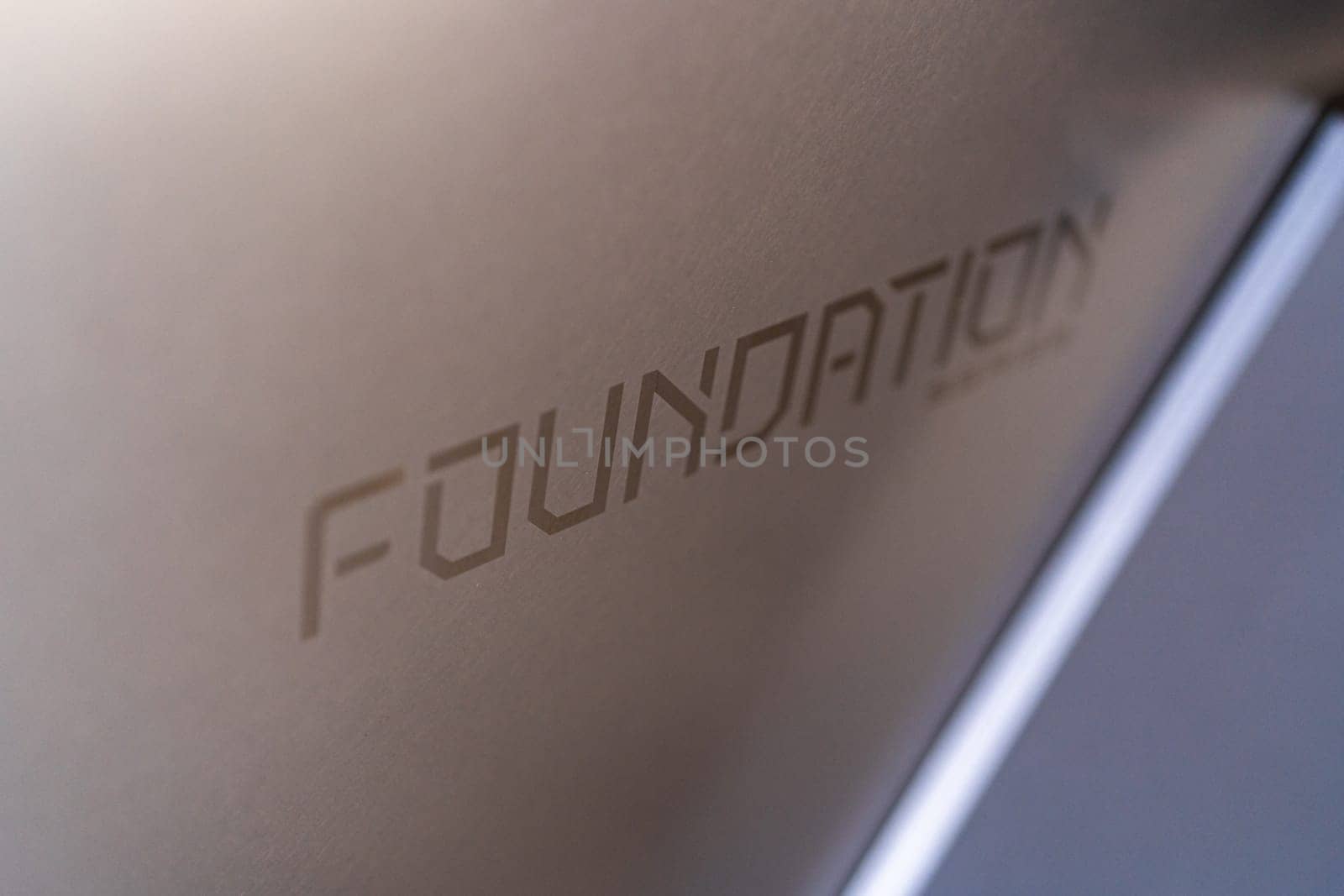Denver, Colorado, USA-May 5, 2024-This close-up image captures the intricately etched Foundation inscription on the body of a Tesla Cybertruck, emphasizing the vehicle unique branding and sleek design.