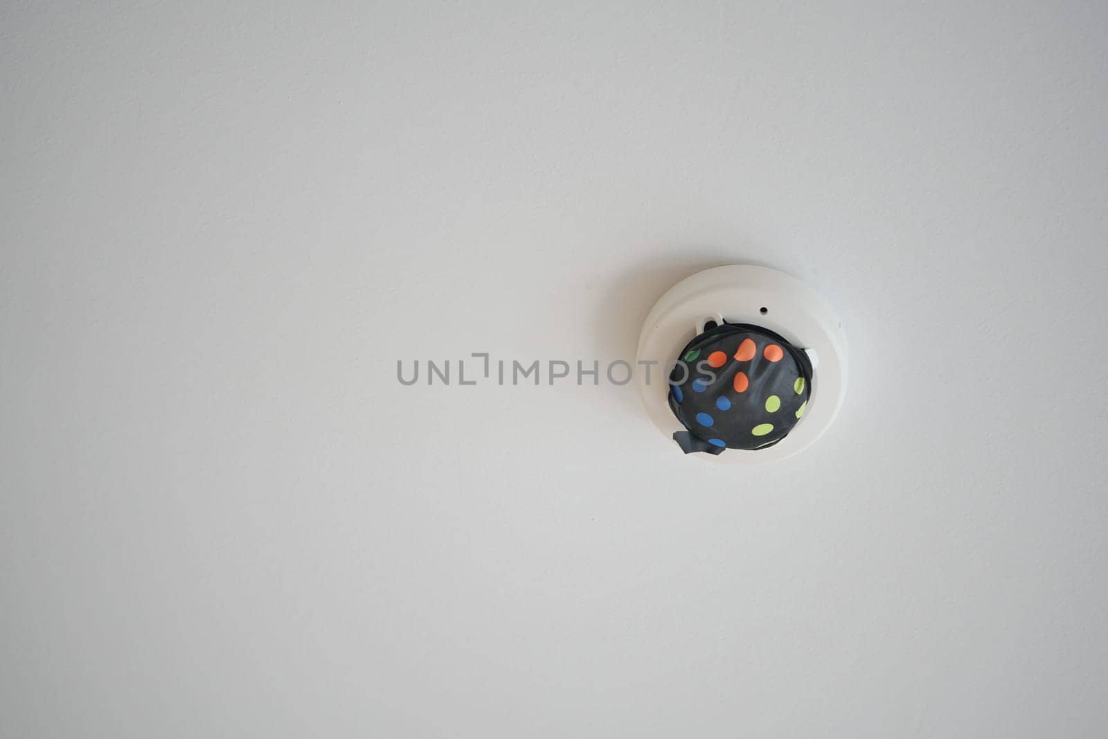 White smoke detector on ceiling. High quality photo