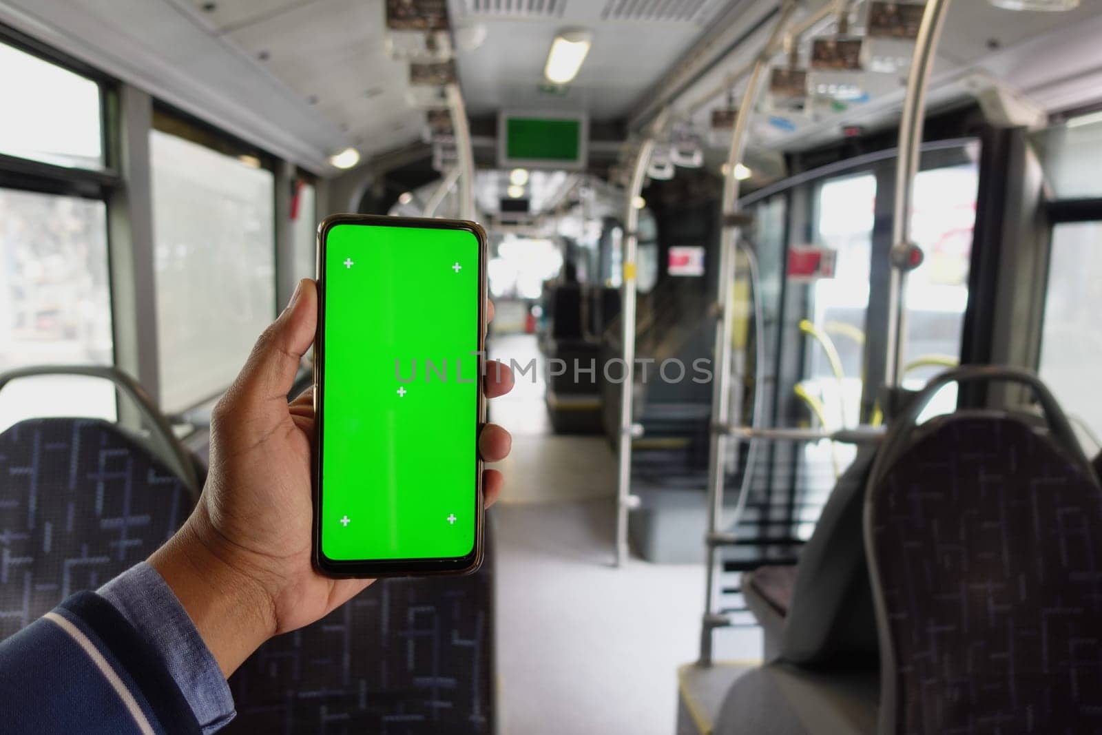 passenger sitting in a bus using his phone with green screen by towfiq007