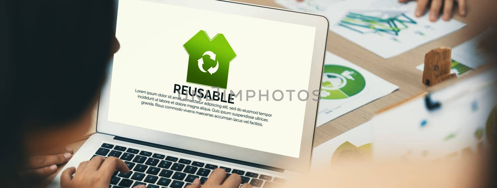 Reusable sign displayed on green business laptop while business team presenting green design to customer. ESG environment social governance and Eco conservative concept. Closeup. Delineation