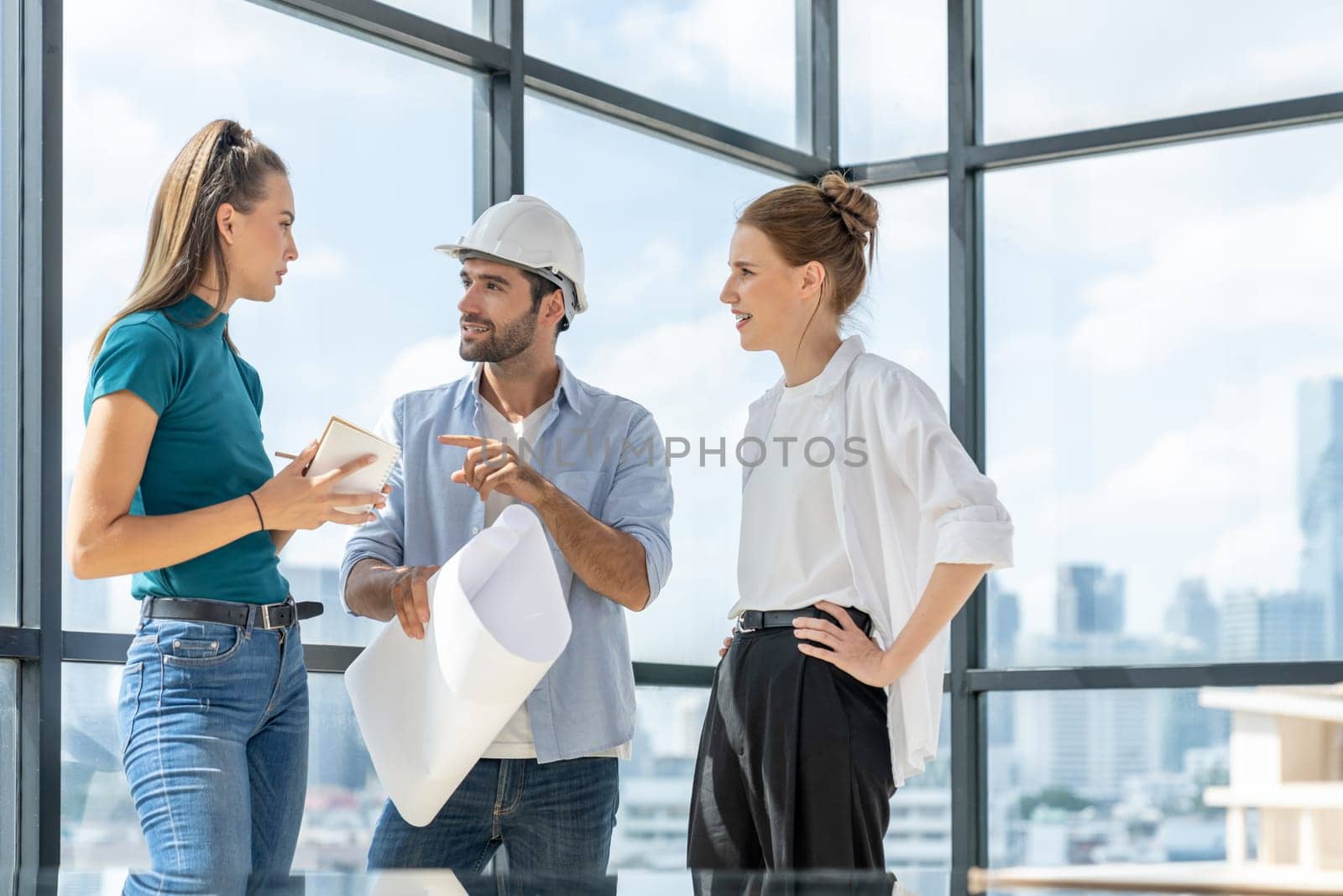 Group of architect engineer looking at project plan while brainstorming idea about building structure. Manager team discuss about building construction while standing near with city view. Tracery.