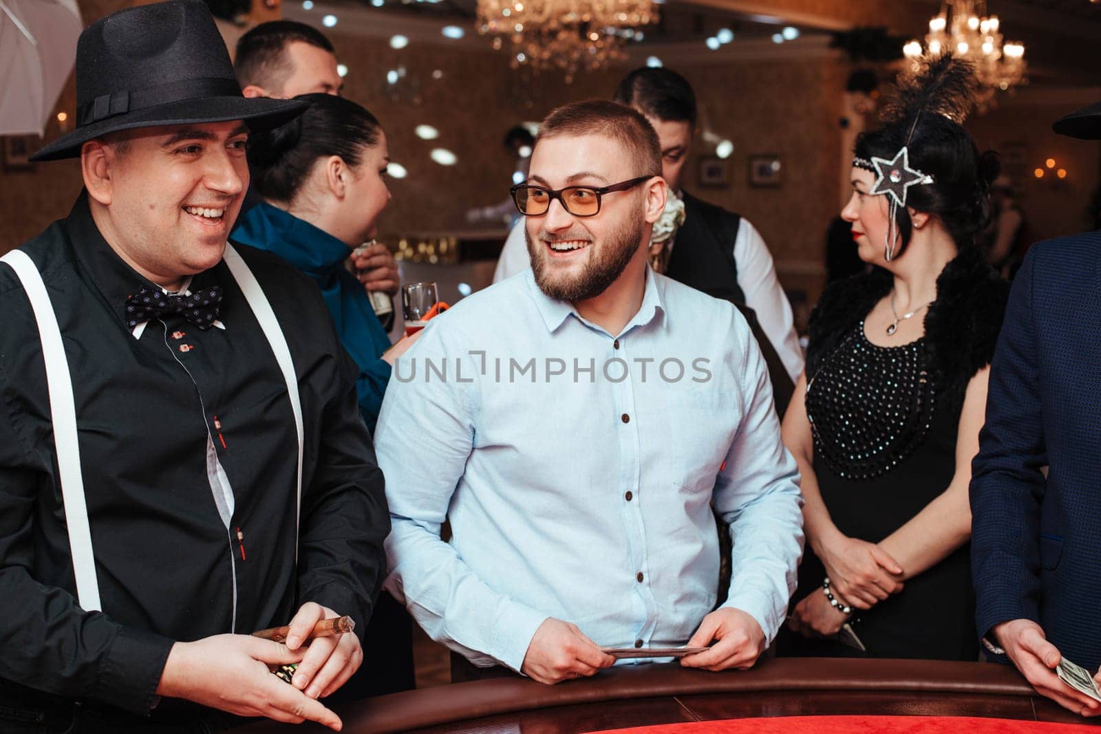 A group of people play in the casino on roulette. Yaremche, Bukovel, Ukraine - January 10, 2022