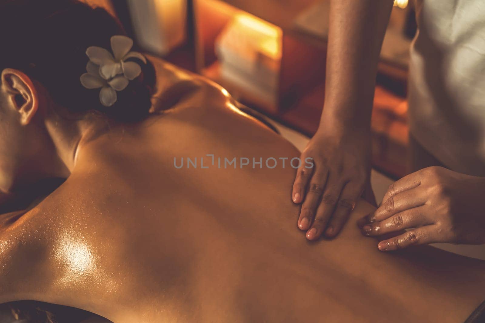Closeup woman customer enjoying relaxing anti-stress massage. Quiescent by biancoblue