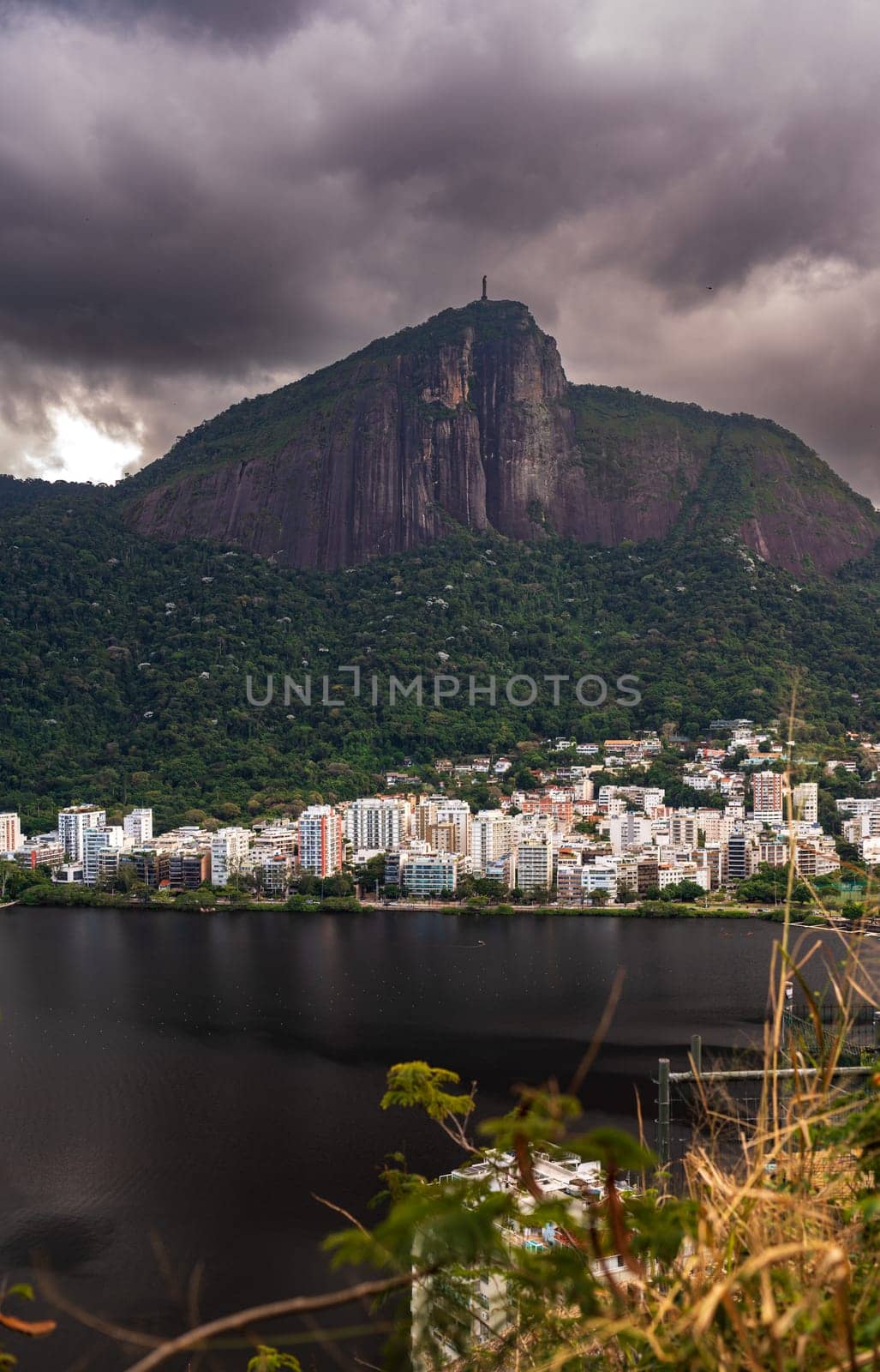 Cloudy Sky Over Iconic Mountain and Lake in Vibrant City by FerradalFCG