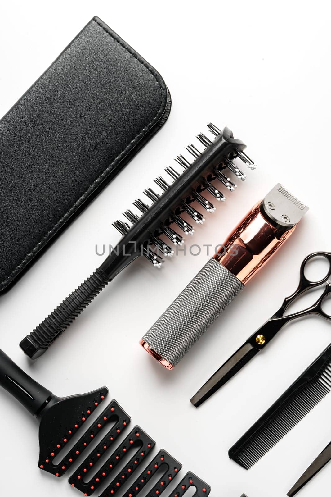 Set of barber tools for haircut on gray background flat lay studio shot